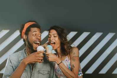 man and woman eating ice creams