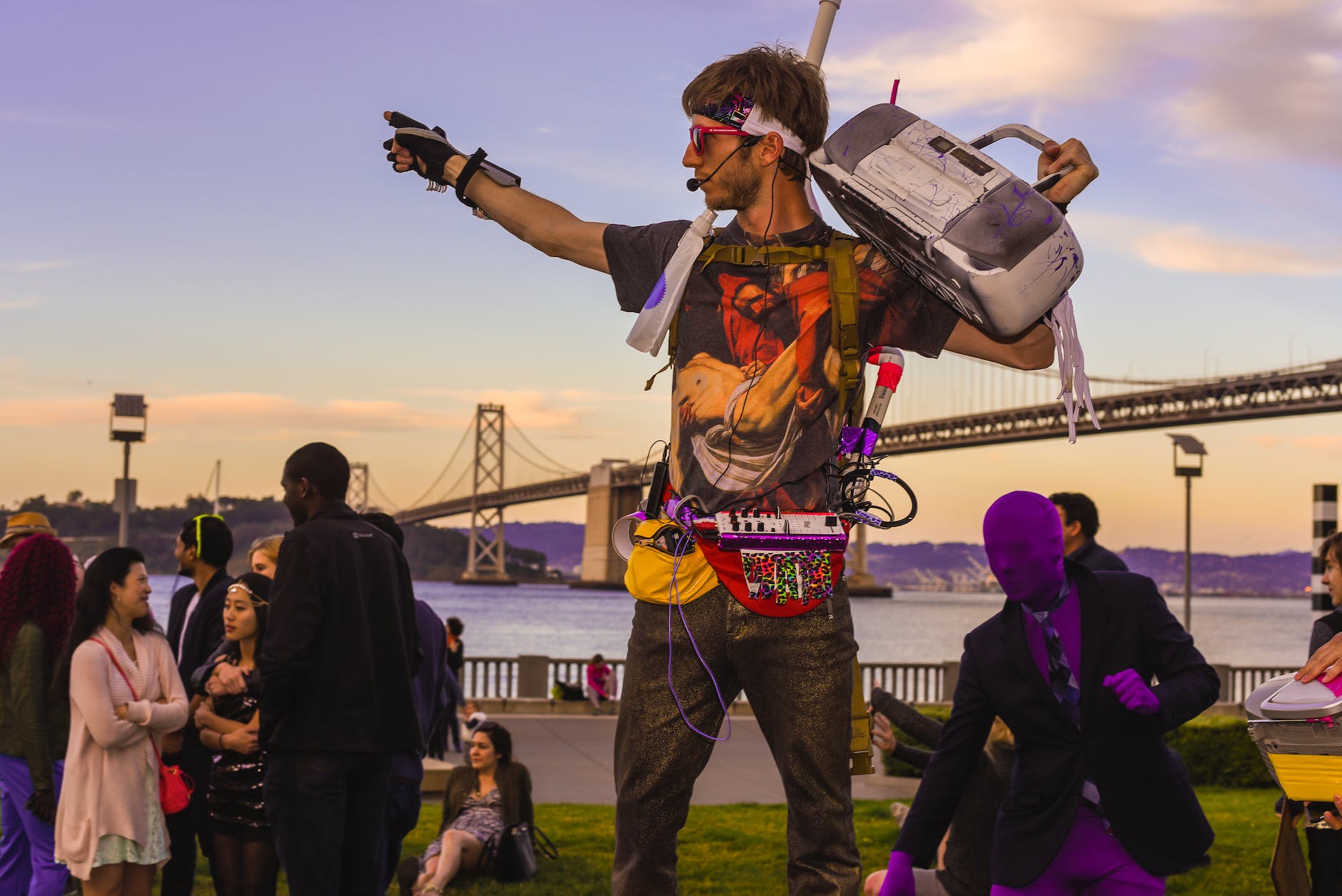 a man holding a vintage cassette player